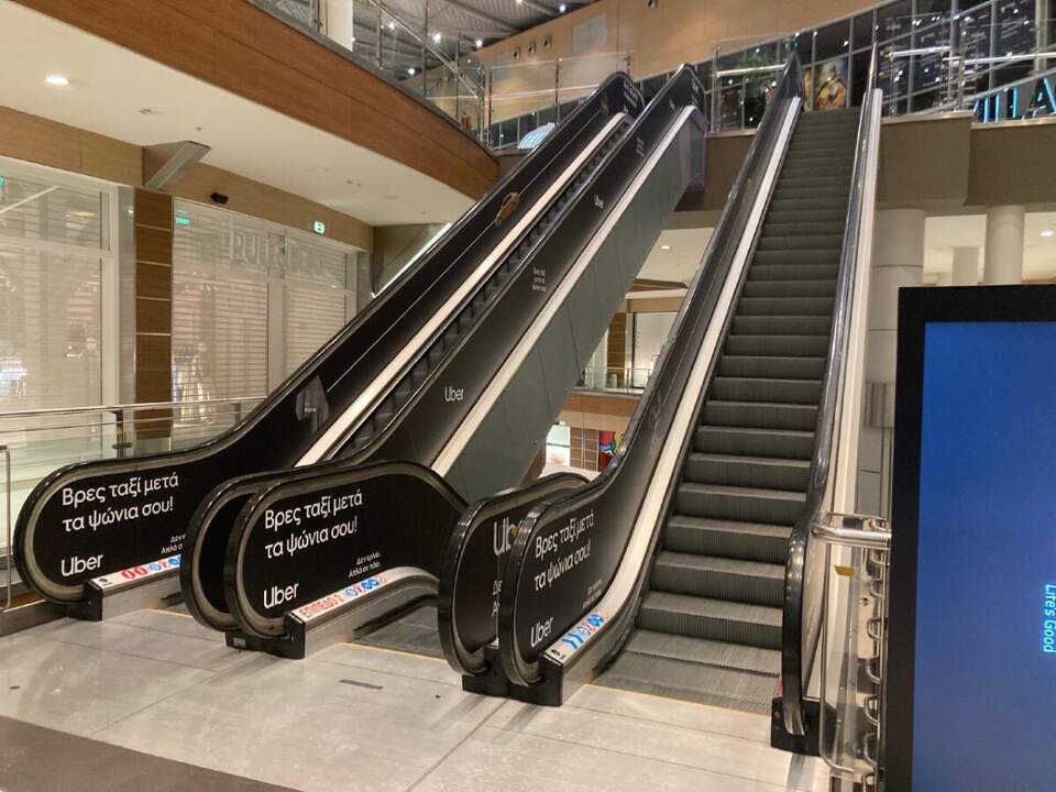Escalator wraps, Uber